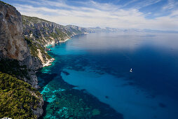 Mountainous coastal landscape, sailing yacht on the sea, Golfo di Orosei, Selvaggio Blu, Sardinia, Italy, Europe