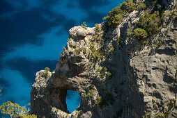 Rock arch on the mountainous coast above the sea, Golfo di Orosei, Selvaggio Blu, Sardinia, Italy, Europe