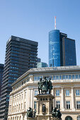 Statue beneath Financial district skyscrapers with Deutsche Bank buillding and Main Tower (Helaba), Frankfurt am Main, Hessen, Germany, Europe