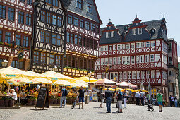 Half-timbered buildings with outdoor seating at restaurants on Roemerberg square, Frankfurt am Main, Hessen, Germany, Europe