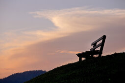 Bench for hikers in the mountains at sunset, Rote Flueh, Gimpel, Hochwiesler, Tannheimer Tal, Tyrol, Austria
