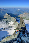 Woman climbing ridge Stuedlgrat towards Grossglockner, Stuedlgrat, Grossglockner, High Tauern, East Tyrol, Austria