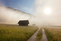 Haystack on a meadow at Geroldsee, view to Karwendel, Werdenfels region, Bavaria, Germany