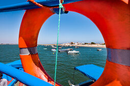 Ferry boat to Armona island, View through lifebuoy, Olhao, Algarve, Portugal