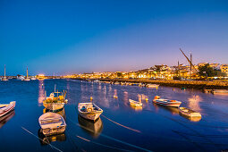 View from harbour towards old town at twilight, Lagos, Algarve, Portugal