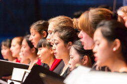 Young Chinese and German women singing at a concert, choir at the open air concert, German Chinese choir at the Bachfest Leipzig 2015, Bach Academy, Leipzig, Saxony, Germany