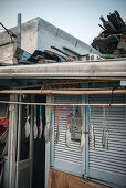 small fishes hanging for drying in front of house at fishing village Tai O, Lantau Island, Hongkong, China, Asia