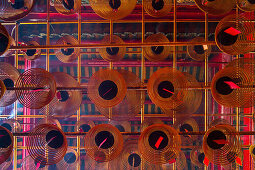 historic Man Mo temple, spiral incense coils, red, from below, graphic, traditional, religion, historic, detail, Hong Kong, China, Asia