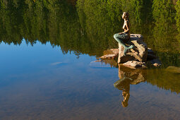 Mermaid sculpture at lake Mummelsee, Black Forest, Baden-Wuerttemberg, Germany