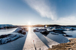 Man standing at Vatnajokul at sunset, Winter, Cold, Iceland