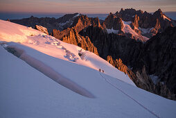 Morning dawn ascending the Barre des Ecrins with views of the Meije, Ecrins National Park, Dauphiné, France