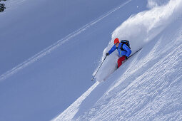 Man downhill skiing from Sonnenjoch through deep snow in the back-country, Sonnenjoch, Kitzbuehel Alps, Tyrol, Austria