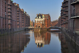 Moated castle Wasserschloss in quarter Speicherstadt at Wandrahmsfleet, Hanseatic City Hamburg, Northern Germany, Germany, Europe