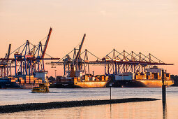 Sunset with container ships in Hamburg harbour, north Germany, Germany