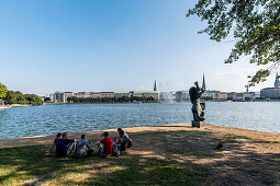 young people sitting at the Binnenalster in Hamburg, north Germany, Germany