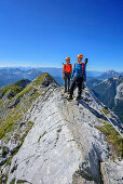 Two women climbing on fixed-rope route Mittenwalder Hoehenweg, fixed-rope route Mittenwalder Hoehenweg, Karwendel range, Upper Bavaria, Bavaria, Germany