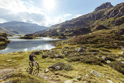 Mountainbiker at Giglach Lake, Lower Tauern Mountains, Steiermark, Austria