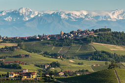 snow on the mountains, alps, vineyards in the Langhe landscape in Piedmont, Italy