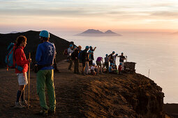tourists on the summit of Stromboli Volcano at sunset, Stromboli Island, Aeolian Islands, Lipari Islands, Tyrrhenian Sea, Mediterranean Sea, Italy, Europe