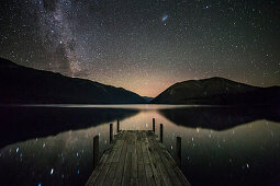 Kerr Bay at night, Lake Rotoiti, Reflection of stars in the lake, Nelson Lakes National Park, South Island, New Zealand, Oceania