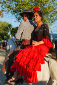 horseriding couple at the Feria de Abril, Seville Fair, spring festival, Sevilla, Seville, Andalucia, Spain, Europe