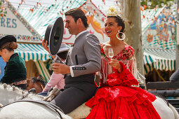 horseriding couple at the Feria de Abril, Seville Fair, spring festival, Sevilla, Seville, Andalucia, Spain, Europe