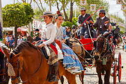 horseriding couple on horseback, Feria de Abril, Seville Fair, spring festival, Sevilla, Seville, Andalucia, Spain, Europe