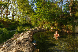 Woman bathing in a hot sping, Balneario, thermal bath, basin, Alhama de Granada, Granada province, Andalucia, Spain, Europe