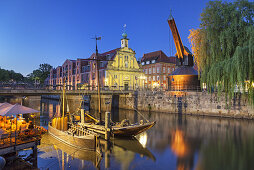 Sailing ships, crane and houses by the old harbour in the Hanseatic town Lüneburg, Lower Saxony, Northern Germany, Germany, Europe