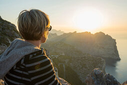 woman watching the sunset, Cap Formentor, Port de Pollenca, Serra de Tramuntana, Majorca, Balearic Islands, Spain