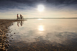 man and woman, eBike, Lakeshore, Muensing, Upper Bavaria, Germany