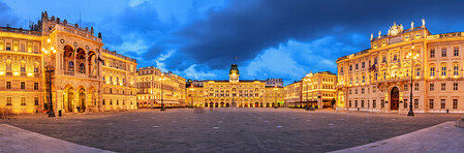Panorama with illuminated town hall of Trieste, Trieste, Venezia, Italy