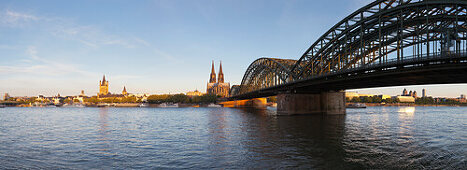 Panoramic view over the Rhine river to the Old town with Gross-St Martin, Museum Ludwig, cathedral and Hohenzollern bridge, Cologne, North Rhine-Westphalia, Germany