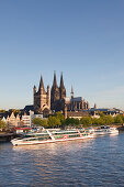 View over the Rhine river to the Old town with Gross-St Martin and Cologne cathedral, Cologne, North Rhine-Westphalia, Germany