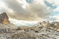 man standing at the landscape at dolomites, panel houses, dolomites, south tyrol, trentino, italy, europe