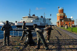 Harbor with ferry from Helsingborg to Helsingoer, monument in foreground, Helsingborg, Southern Sweden, Skane, Southern Sweden, Sweden
