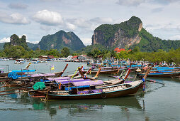 Long boats on a river near Krabi, Thailand