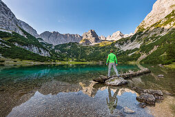 hiker at scenic lake Seebensee in the Mieminger mountains, Tirol, Austria