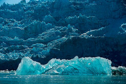 A large iceberg of translucent ice floats in front of the Sawywer Glacier, Tracy Arm, Stephens Passage, Tongass National Forest, Tracy Arm-Fords Terror Wilderness, Alasksa, USA, North America