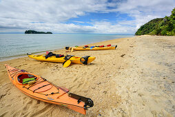 Three kayaks laying in bay, Abel Tasman Coastal Track, Great Walks, Abel Tasman National Park, Tasman, South island, New Zealand