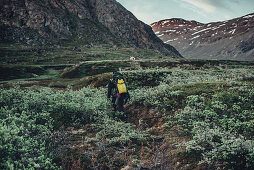 Hiker on a route through greenland, greenland, arctic.