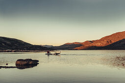 Men with a rowing boat in greenland, greenland, arctic.