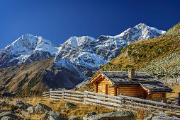 Alpine hut in front of Koenigsspitze, Zebru and Ortler in alpenglow, Sulden, Ortler group, South Tyrol, Italy