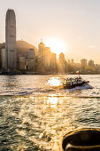 The skyline of Hong Kong Island seen trough the window of a Star Ferry ferry line during sunset, Hong Kong, China, Asia