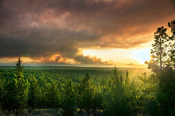 USA, Oregon, Bend, the smoke of the two bulls fire near Bend billows into the sky, turning it an array of colors