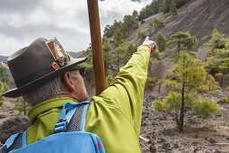 hiking guide with canarian crook, man, hiking tour along PR LP 14, hiking trail near Montana Quemada, volcanic crater, Llano del Jable, Parque Natural de Cumbre Vieja, UNESCO Biosphere Reserve, La Palma, Canary Islands, Spain, Europe