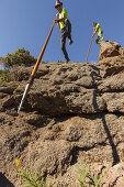 men jumping with the canarian crook, Salto del Pastor Canario, crater rim, Caldera de Taburiente, UNESCO Biosphere Reserve, La Palma, Canary Islands, Spain, Europe