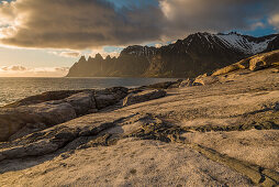 during midnightsun at the coast of Tungeneset with devils teeth, island of Senja, Norway