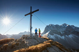 two women on Hahnkampl peak  Lamsenspitze in the back ,  Eastern Karwendel Range, Tyrol, Austria