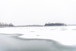 Seventeen Arch bridge leading to Nanhu Island, new Summer Palace in Beijing in Winter, frozen Kunming Lake, China, Asia, UNESCO World Heritage